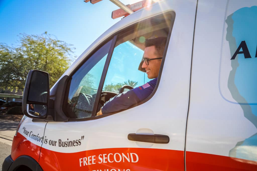 Canyon State AC and Plumbing service tech in company truck